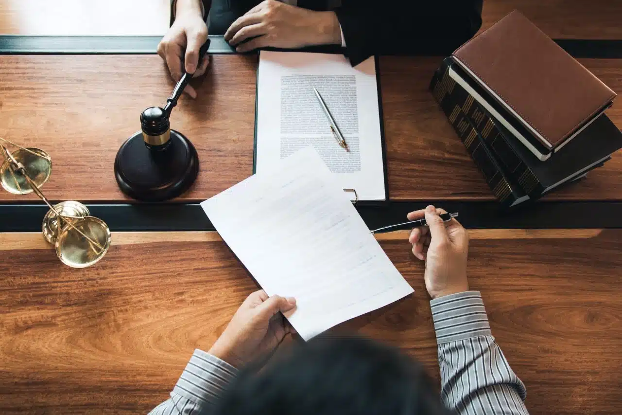 client-is-bringing-the-documents-to-clarify-the-law-to-the-lawyer-at-the-prosecutor-office-.jpg